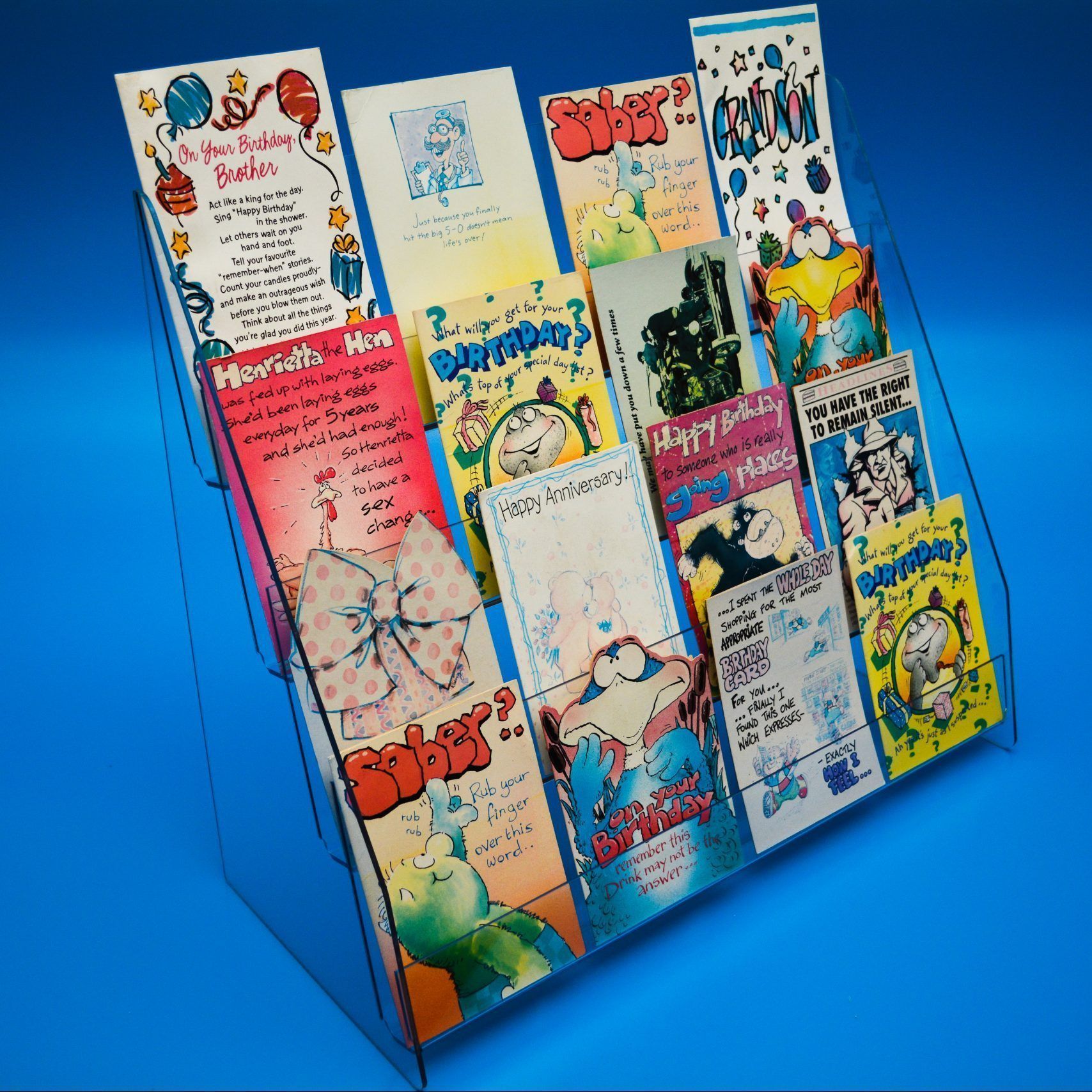 4-tier greeting card display stand designed to sit of shelf or counter, showing a range of greeting cards