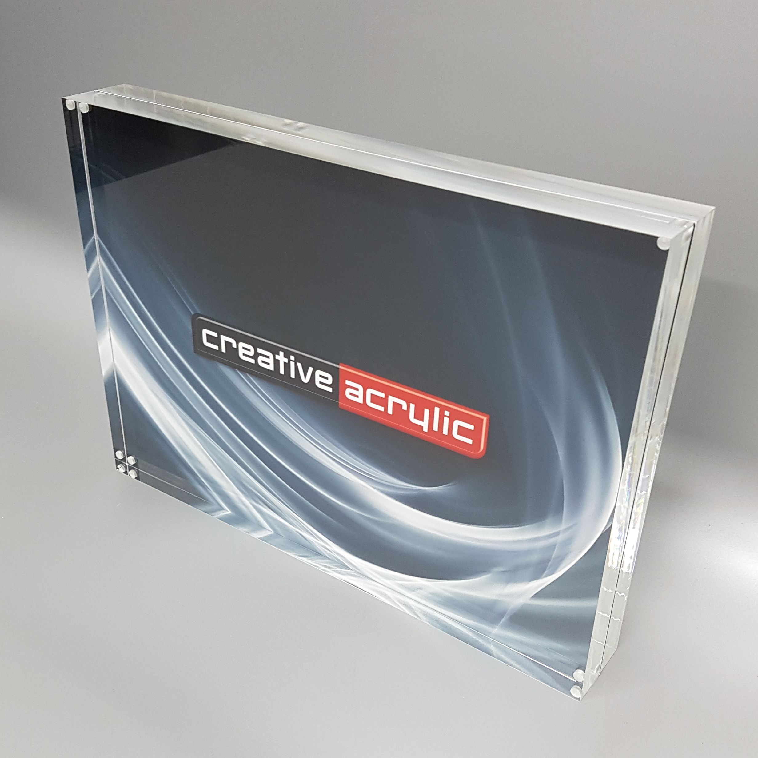 clear acrylic magnetic picture frame used to sandwich items between two slabs of acrylic.