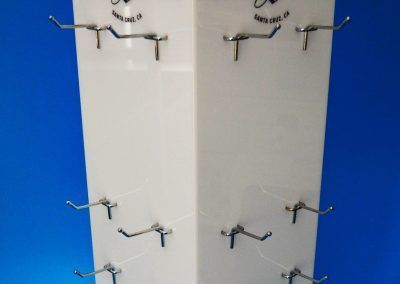 Opal acrylic product display spinner with metal prongs to hold product
