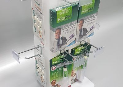 White acrylic product display with removable metal hooks