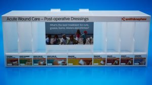 Opal acrylic pharmaceutical display unit with individual product pockets
