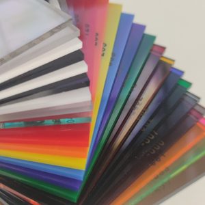 Sample swatches of 3mm acrylic panels in a range of colours layered in a stack