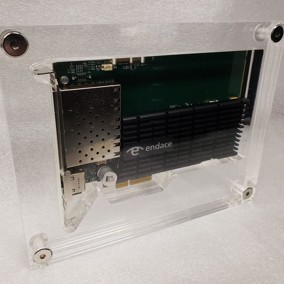 Item enclosed in layered sections of clear acrylic - completely enclosed