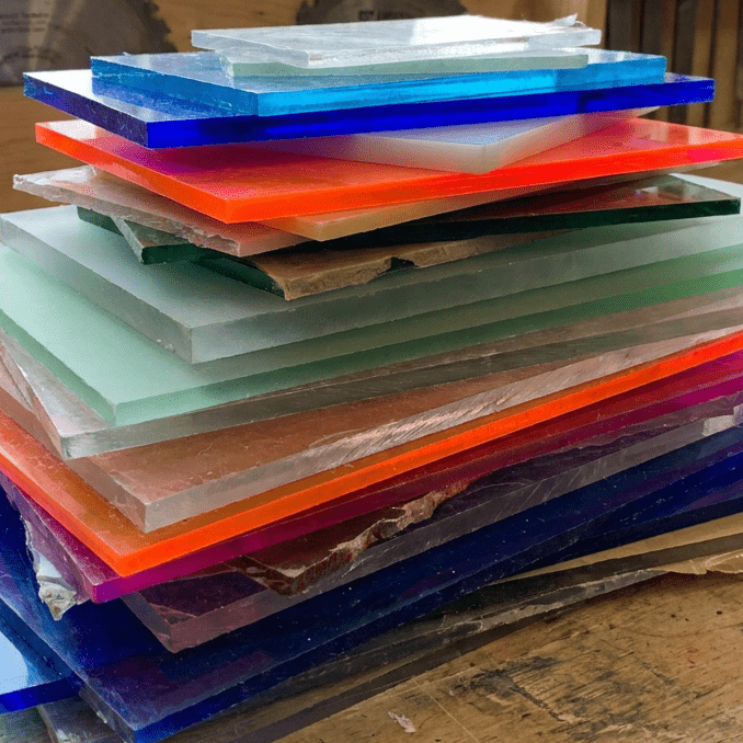 Layered Stack of Acrylic Off-cuts Messy stack of latered acrylic showing off-cuts used for recycling.
