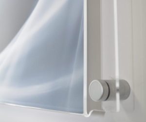 Corner/side view of an easy change graphic holder secured to the wall with a satin chrome sign mount