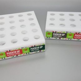 White acrylic fabricated lip balm displays with vinyl decals applied