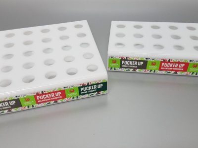 White acrylic fabricated lip balm displays with vinyl decals applied