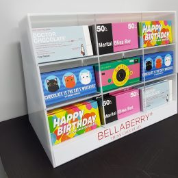 Free standing custom sectional display manufactured to house chocolate bars for the hospitality industry