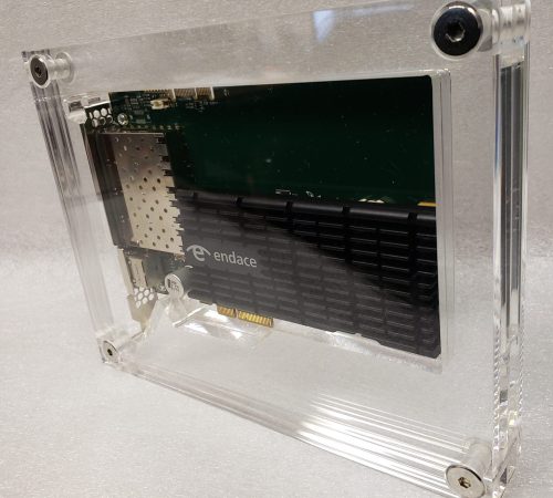 Multiple panels of acrylic sandwiched together with chrome interscrews, housing a computer component