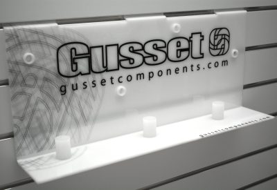 White acrylic slatwall display unit with custom graphics