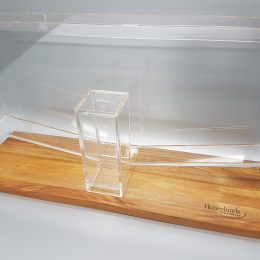 Custom clear acrylic honey dripper glued to engraved wooden base