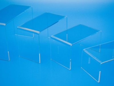Clear acrylic risers manufactured in four different sizes to raise and promote products