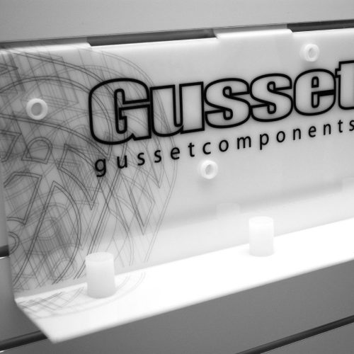 White acrylic slatwall display unit with custom graphics