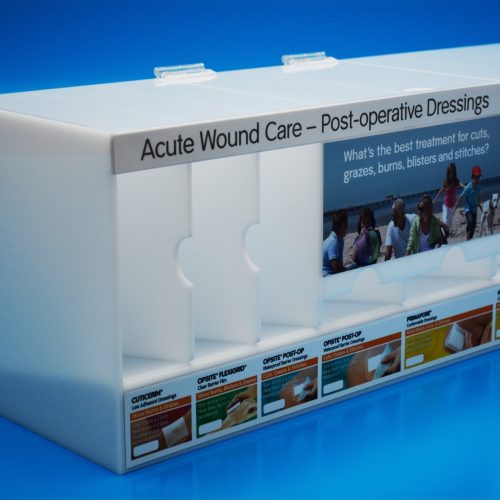 Pharmaceutical Display - Manufactured in opal acrylic with sections for different wound care products. Hinged lid for ease of access to drop feeder sections.