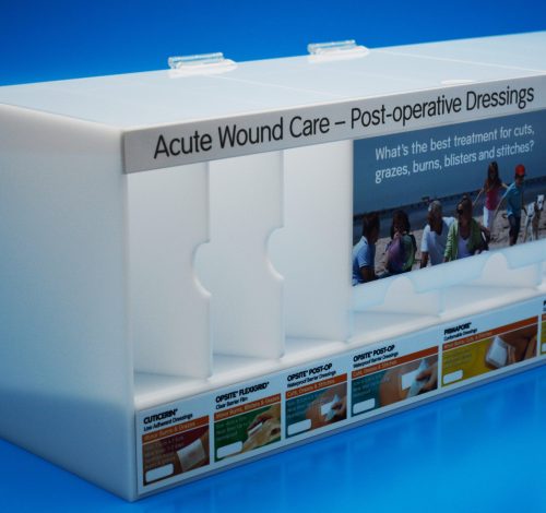 Pharmaceutical Display - Manufactured in opal acrylic with sections for different wound care products. Hinged lid for ease of access to drop feeder sections.