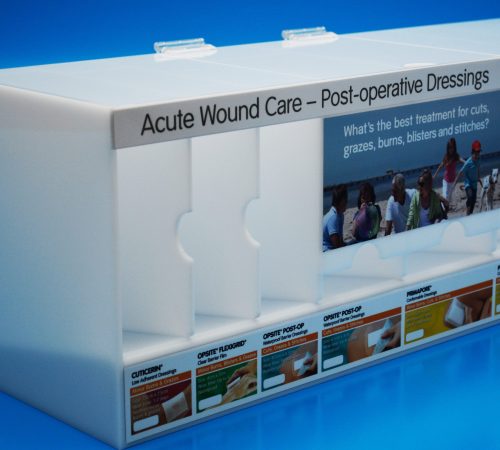 Pharmaceutical Display - Manufactured in opal acrylic with sections for different wound care products. Hinged lid for ease of access to drop feeder sections.