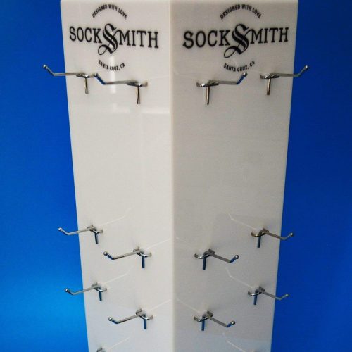 Opal acrylic product display spinner with metal prongs to hold product