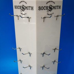Opal acrylic product display spinner with metal prongs to hold product