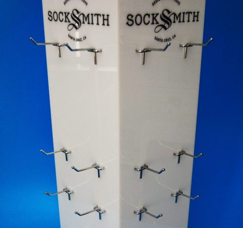 Opal acrylic product display spinner with metal prongs to hold product