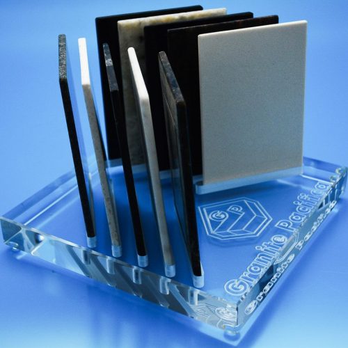 Reversed text engraved into underside of acrylic block to create etched like finish with slots for sample products