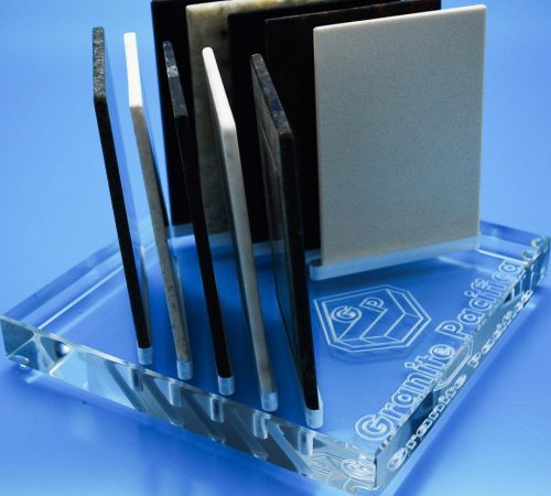 Reversed text engraved into underside of acrylic block to create etched like finish with slots for sample products