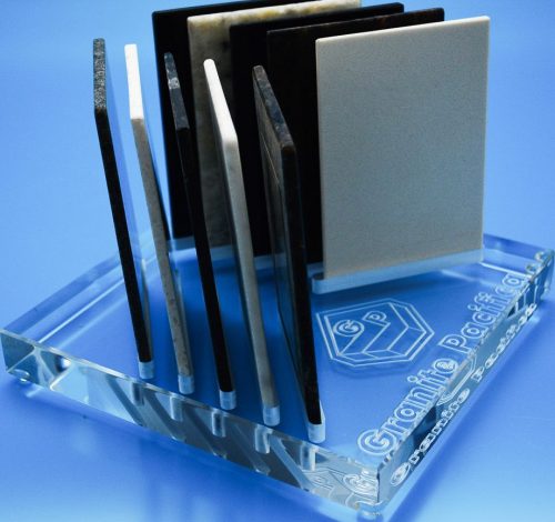 Reversed text engraved into underside of acrylic block to create etched like finish with slots for sample products