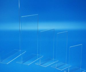 Sign Holders Portrait vertical menu holders manufactured in clear acrylic and showing a range of available sizes.