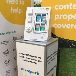 Custom Display stand with hinged display door and product adhered to the front