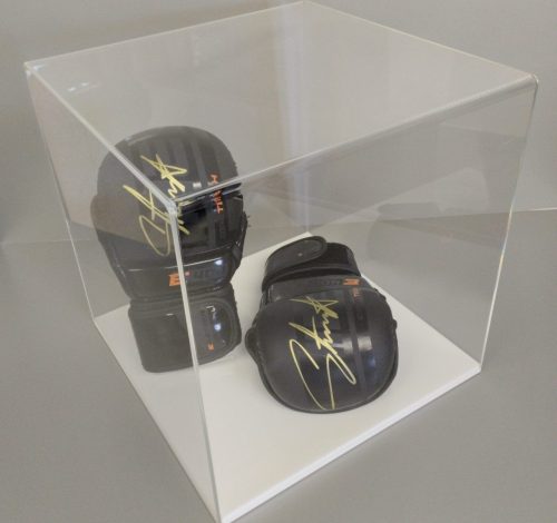 Clear acrylic 5-sided display cube on a white acrylic base, housing signed boxing gloves.