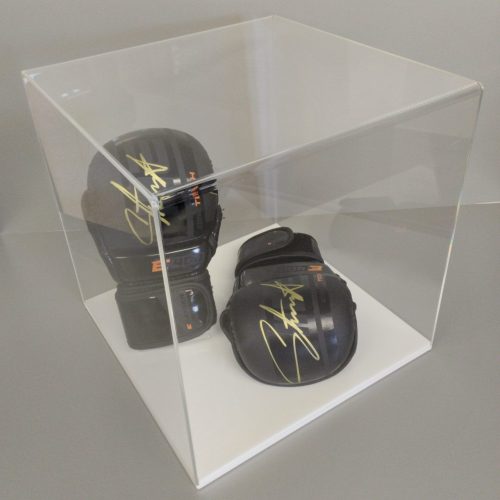 Clear acrylic 5-sided display cube on a white acrylic base, housing signed boxing gloves.