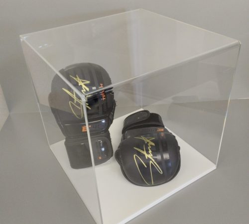 Clear acrylic 5-sided display cube on a white acrylic base, housing signed boxing gloves.