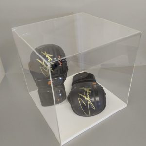 Clear acrylic 5-sided display cube on a white acrylic base, housing signed boxing gloves.