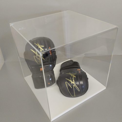 Clear acrylic 5-sided display cube on a white acrylic base, housing signed boxing gloves.