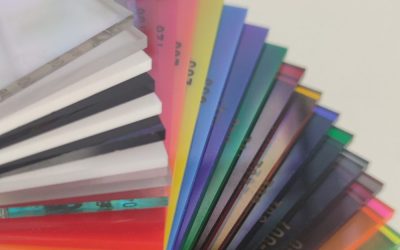 Layered stack of sample swatches showing available options for coloured acrylic.