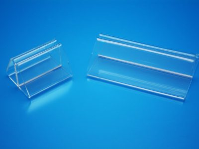 Clear acrylic ticket holders with multiple bends allowing for media to be held in the center.